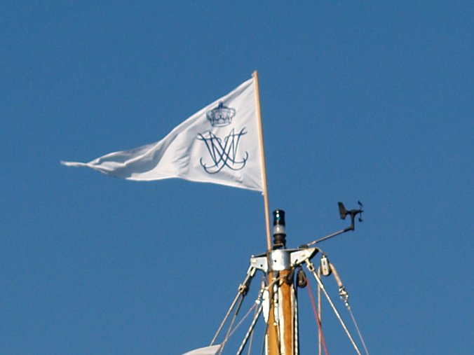 The royal flag on the mast of Afroessa